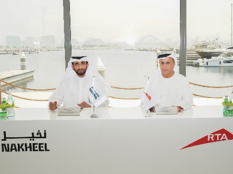 an image of Al Tayer and Al Shaibani during the signing of the agreement