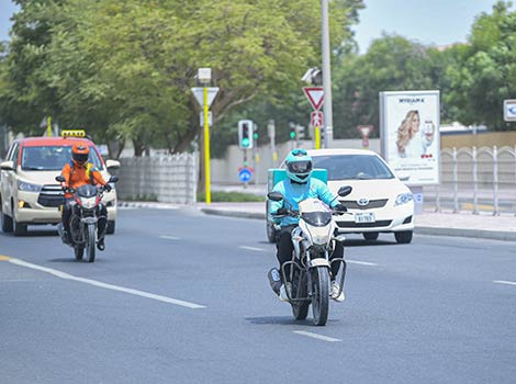 an image of a delivery service on Dubai roads