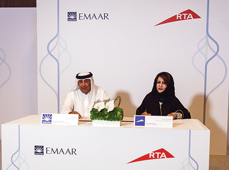 Representative of RTA and Emaar signing the agreement
