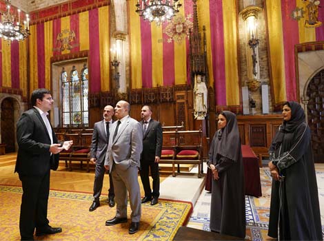 an image of Al Tayer listens to an explanation from the Spanish official