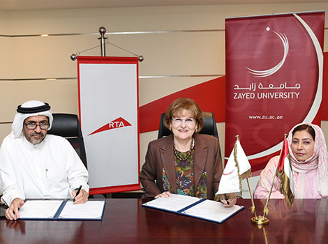 an image of Yousef Al Rida (left) and Dr. Marilyn Roberts (right) signing the MoU