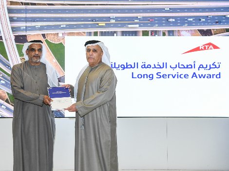 an image of Al Tayer decorating long-service employees